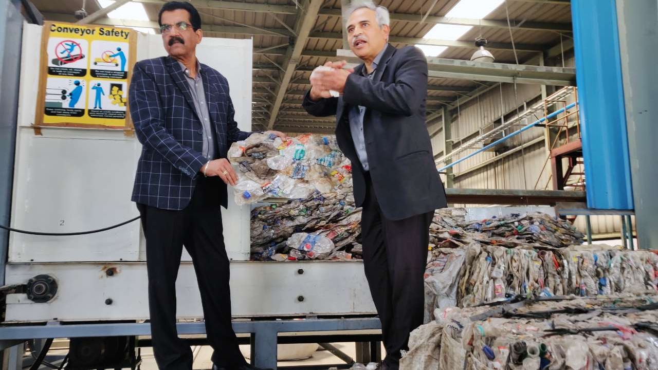 Jeevaraj Pillai, joint president, Packaging and New Product Development, UFlex (right) explaining about PET bottles recycling at the plant Jeevaraj Pillai, joint president, Packaging and New Product Development, UFlex (right) explaining about PET bottles recycling at the plant