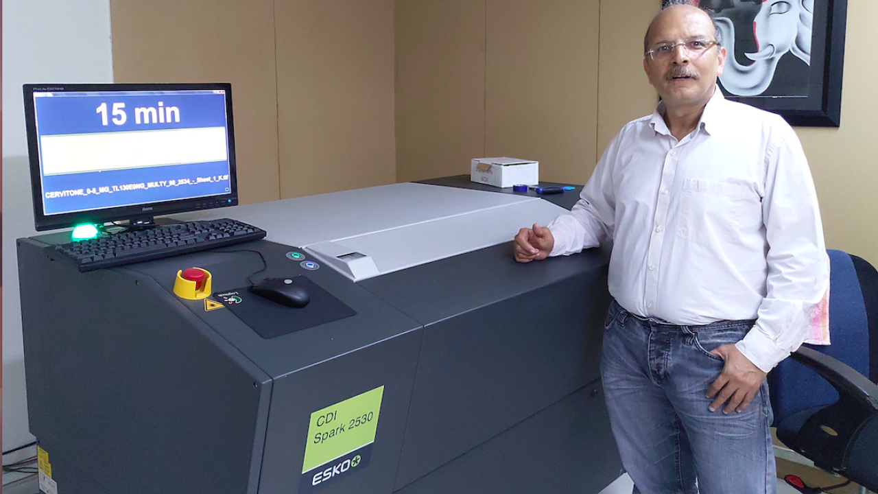 Founder of KEM Cards, Haresh Rajani, with new equipment from Esko CDI Spark 2530