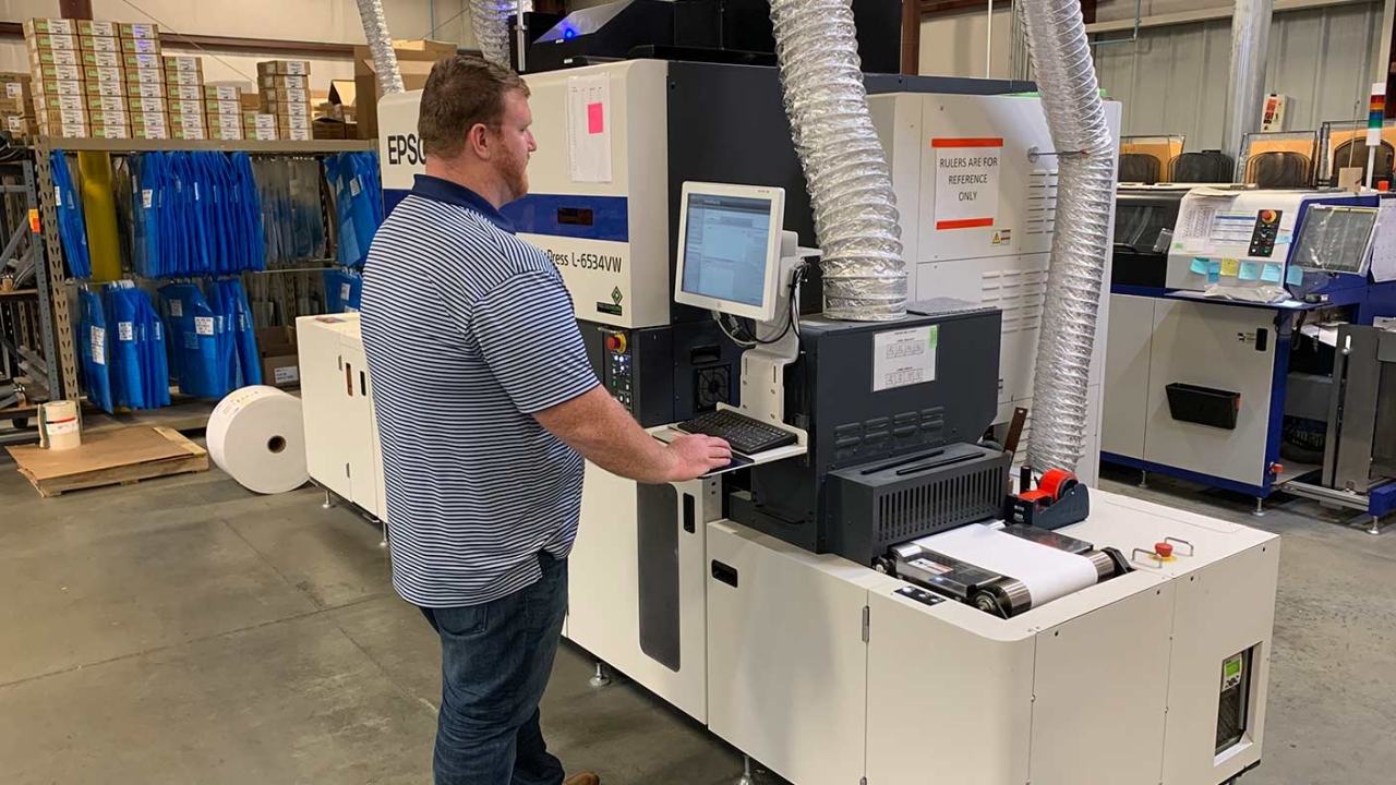 Company installed the SurePress L-6534VW with digital varnish capabilities