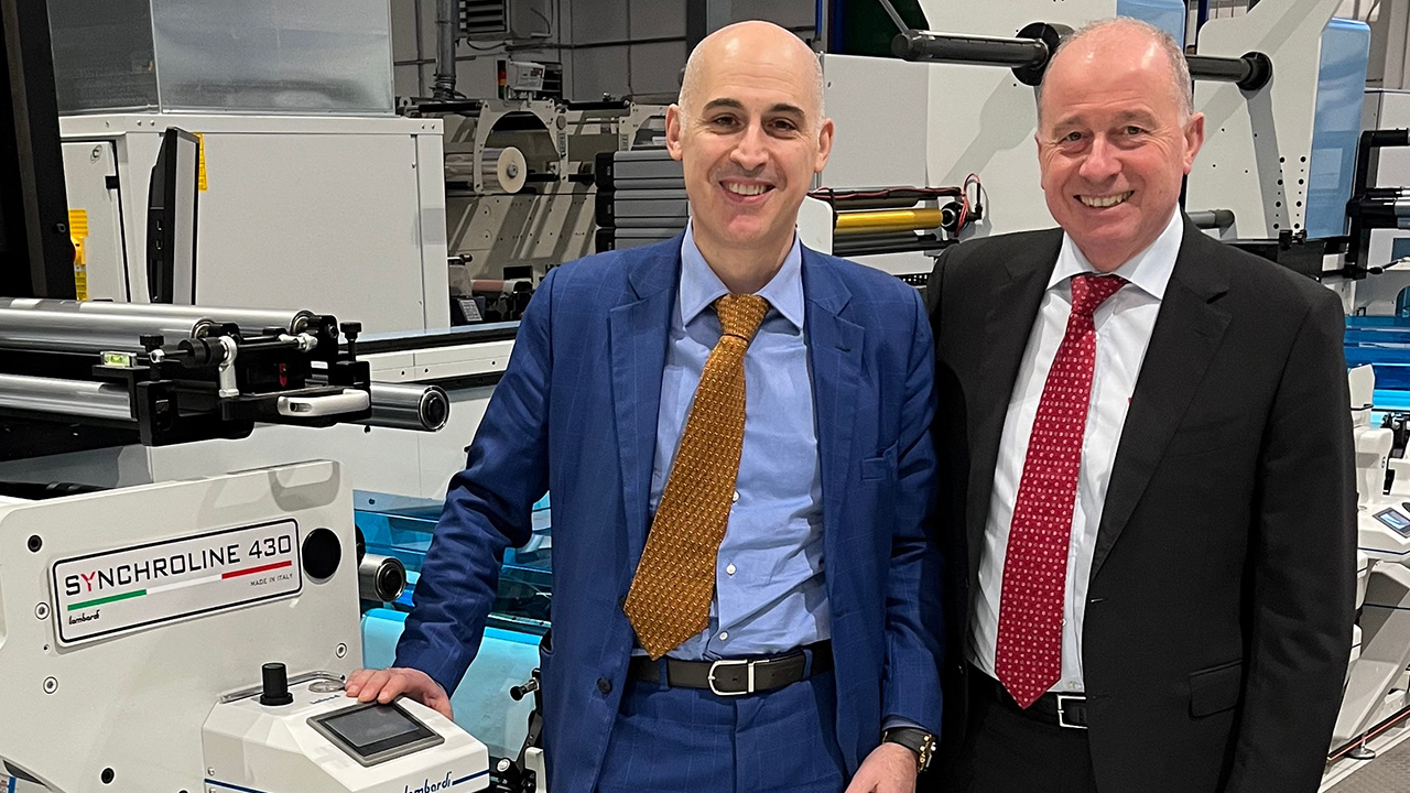 L-R: Ivan Caldirola, founder of Minowa Labels and Giuseppe Rossi, Vetaphone's area sales manager for Italy, with one of the Lombardi Synchroline 430 presses.