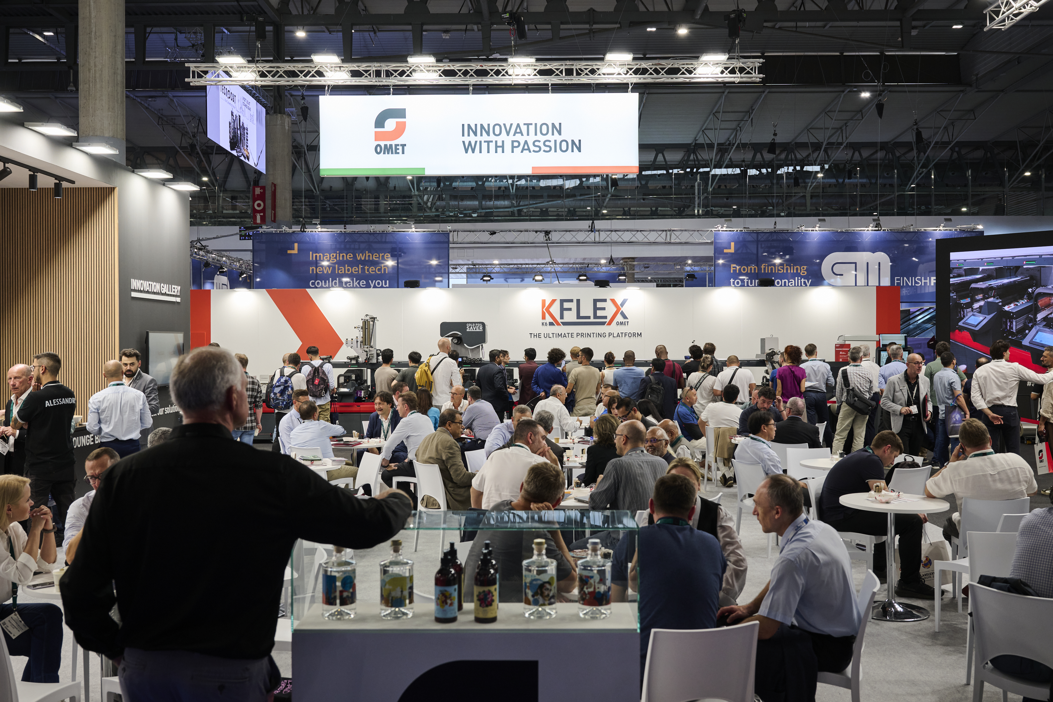 Crowded tables at the Omet booth