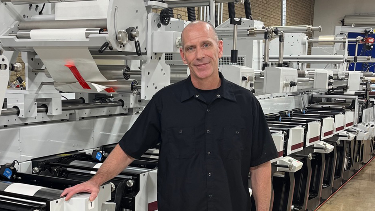 Plant manager Ron Fowler in front of a flexo press
