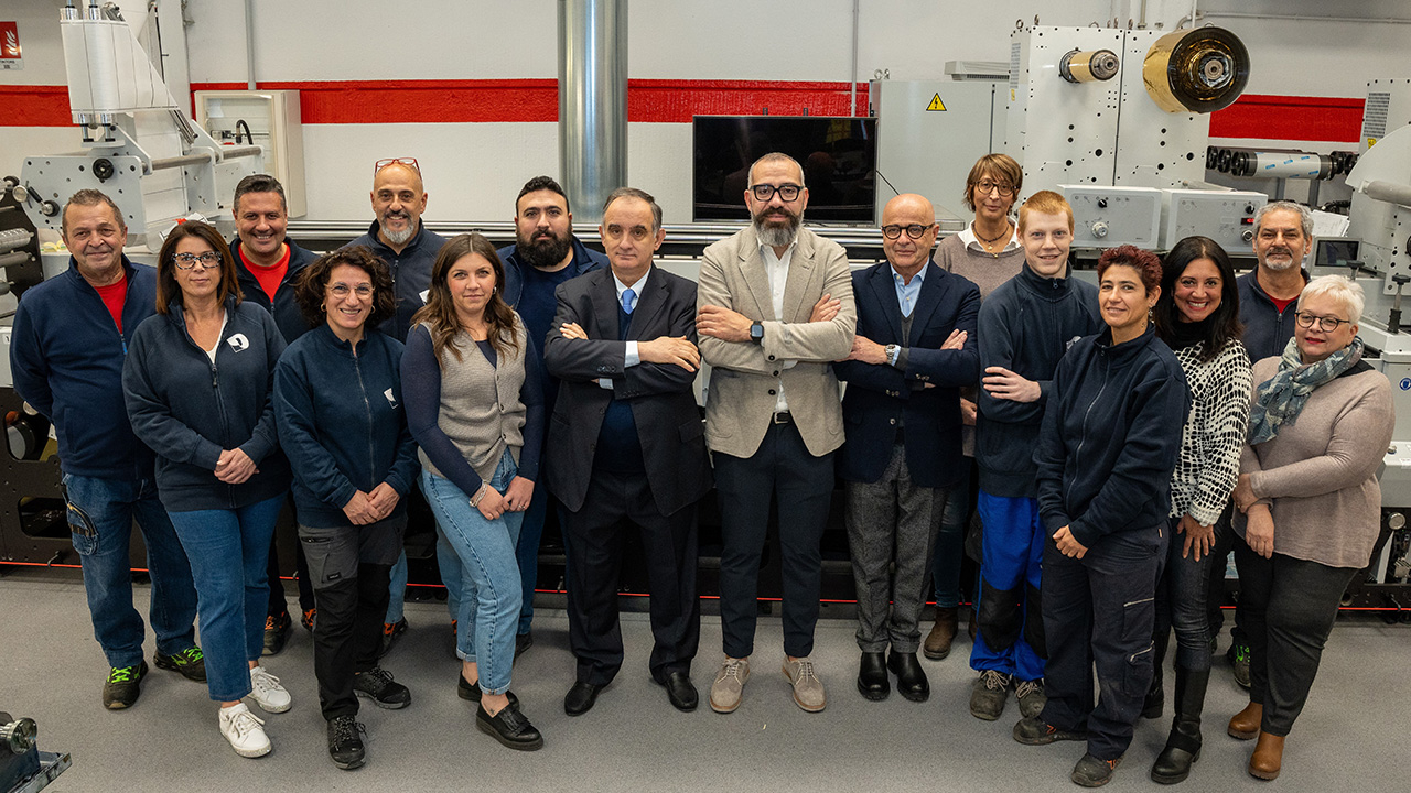 Matteo Angiulli, owner of Decograph, and his team in front of the Mark Andy Evolution E3 flexo press.