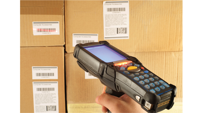 Figure 1.9 - A hand-held scanner being used to read barcodes in a warehouse