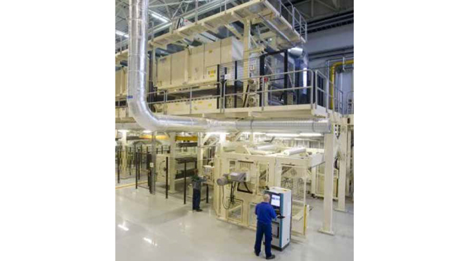 Figure 2.6 A high-speed self-adhesive coating and laminating line. This picture shows the UPM Raflatac coating line in Wroclaw, Poland
