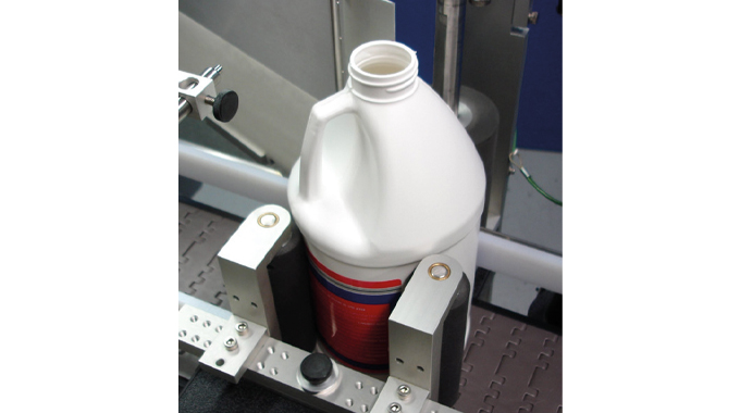 Figure 5.11 - Shows the use of an orientation device to correctly position products prior to applying labels. Illustration courtesy Universal Products Figure 5.11 - Shows the use of an orientation device to correctly position products prior to applyin
