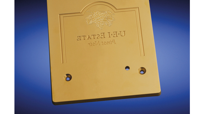 Figure 5.9 - Flatbed brass embossing die. Source UEI Falcontec