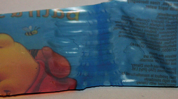 Figure 7.19 Removing the label shows the pooled ink and color change © 2017 Accraply, Inc Figure 7.19 Removing the label shows the pooled ink and color change © 2017 Accraply, Inc