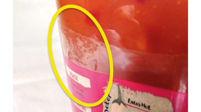 Figure 7.22 The ‘Sellotape’ effect on the transparent label area of this glass bottle © 2017 Accraply, Inc Figure 7.22 The ‘Sellotape’ effect on the transparent label area of this glass bottle © 2017 Accrapl