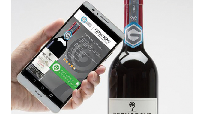 Figure 8.16 - Shows a smart phone NFC authentication process in action. Note NFC symbol on the neck closure. The NFC tag is de-activated on opening, supplying an additional anti-tamper feature.jpg