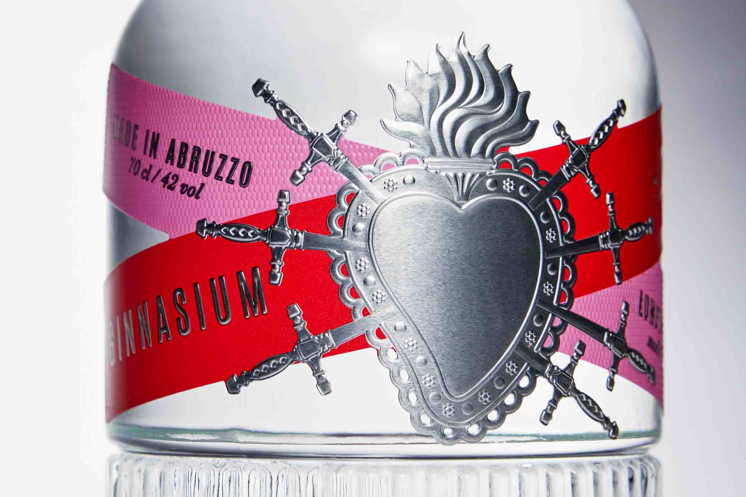 Glossy and embossed papers draw consumer attention to the bottle.
