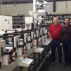 Liberty Marking Systems vice president Brian Beam (right) and production manager Stan Berger (left), with the new Nilpeter FB-3300S flexo press