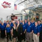 PAC team photo in front of matrix waste removal equipment