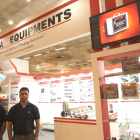 Pawan Kumar Singh, managing director at Mona Equipments with his colleague at the company's stand at Pack Plus India 2014