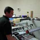 Simon Reade, Malmesbury Labels print manager, laminates, die-less cuts, strips the waste and slits labels printed labels on the Allen Datagraph iTech Centra HS digital label system