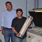 ColorScreen’s John Busch (left), who is responsible for sales and technical service, and Granville Solomons (right), within its screen making department pictured with an SPGPrints RotaMesh rotary screen