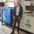 Robert Bongertman, commercial director at Belona in a front of the recently installed Linerless Label Line from Maan Engineering