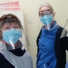 NHS staff at Chesterfield Surgery wearing face shields produced by Rollem