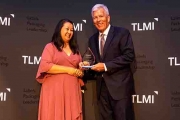 Linda Casey of Packaging Impressions presents Craig Moreland with the TLMI 2021 Converter of the Year Award
