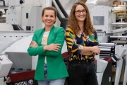 (L-R) Arti-Bau president Monika Stefanska and Urszula Lewandowska with the company's second Mark Andy digital hybrid press, the DSHD model