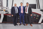 Juan Carlos Arroyave (center), the owner of Etipress, with John Vigna and Kenjiro Celaya of Mark Andy and the newly installed Digital Series HD press