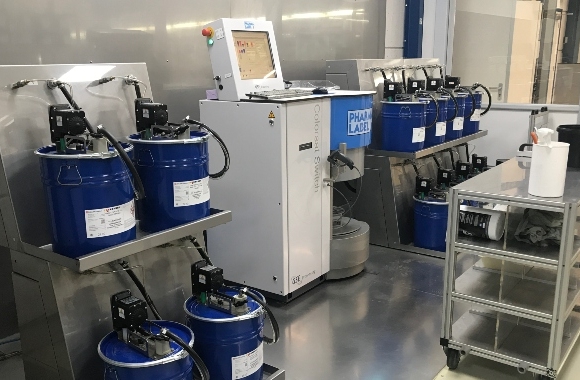 Dispensing equipment in a clean, organized ink kitchen at Pharmalabel in the Netherlands