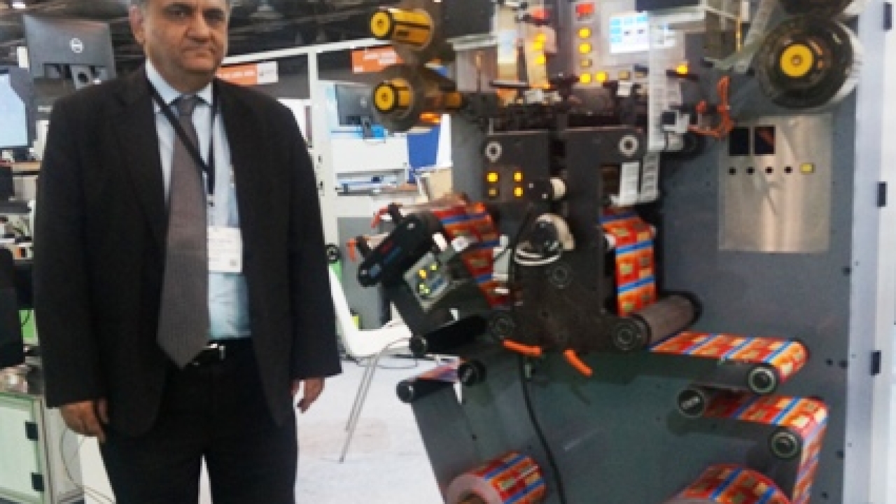 Abhay Datta, director at U V Graphic Technologies in front of ‘The Pony’, the off-line and in-line rotary hot foil stamping machine, at his stand during Labelexpo India 