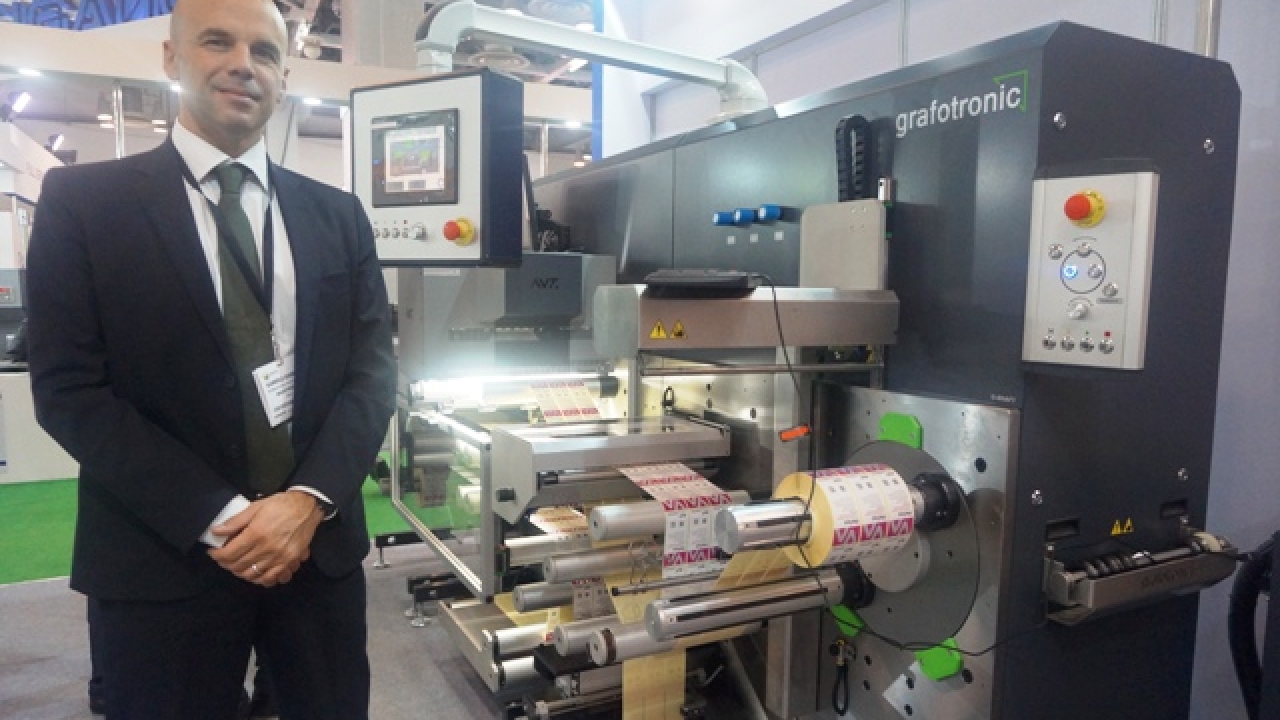 Gabriele Gerbella, international sales manager, Grafotronic at the Reifenhauser stand after anouncing the sale during the show