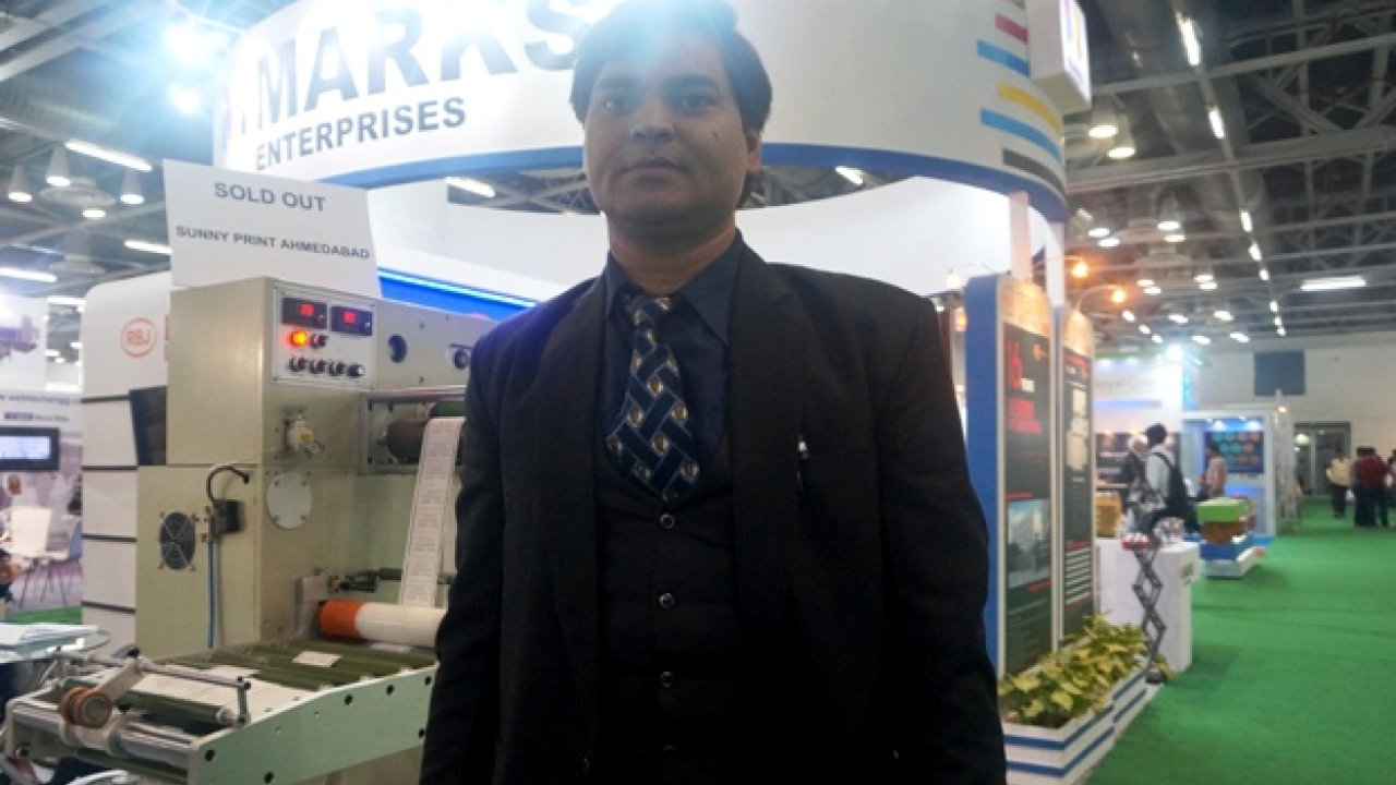Sarfaraz Khan, partner at Marks Enterprises with RBJ 280B flatbed die-cutting machine at Labelexpo India 2016