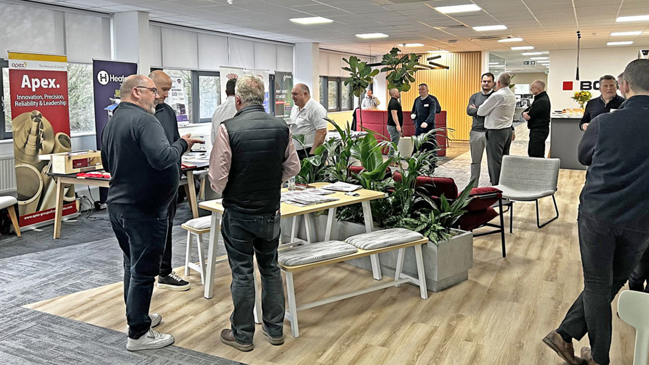 Attendees talk to each other at the Bobst open house