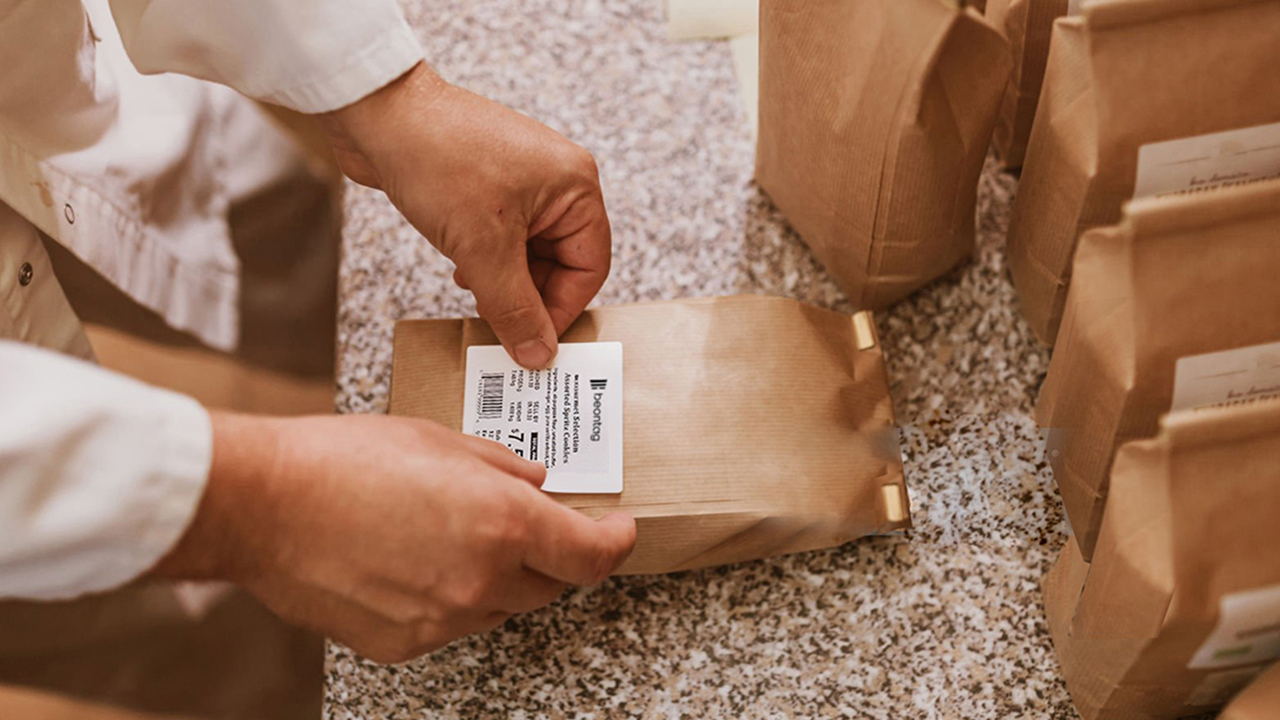 Someone puts a label on a package
