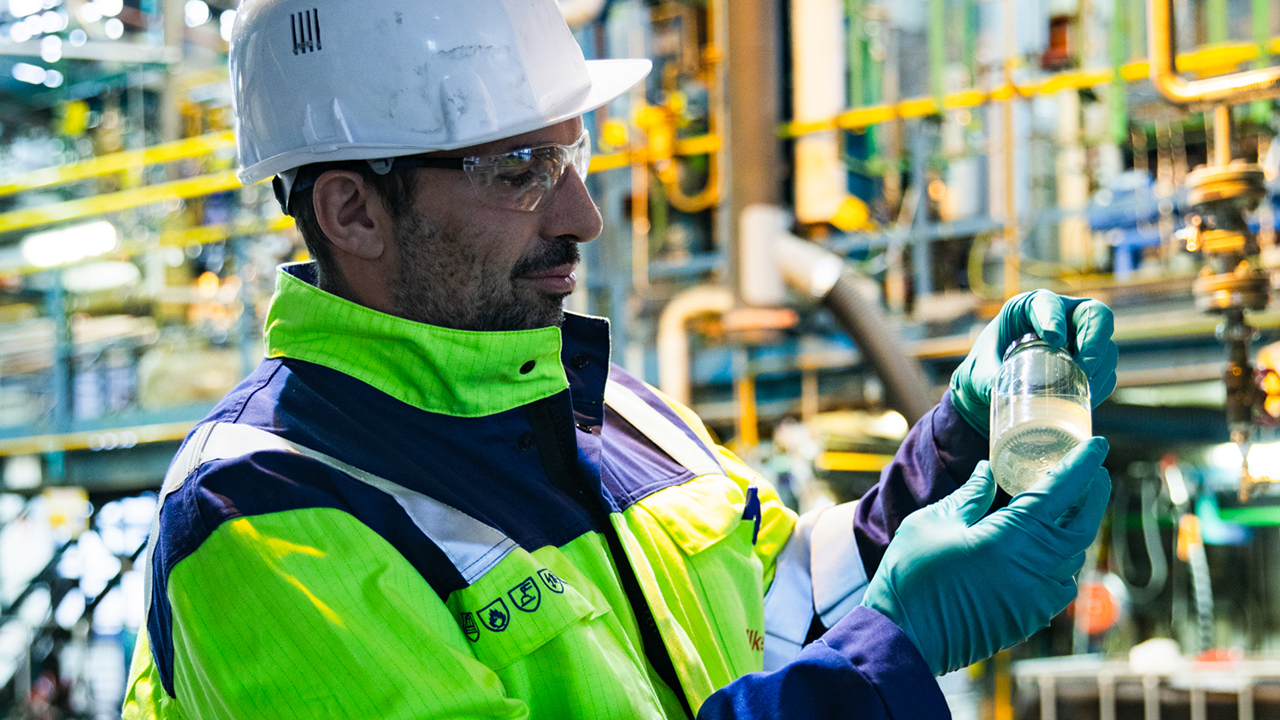 Pilot plant manager Benjamin Dormoy holds a vial of a recycled Silcolease Re product