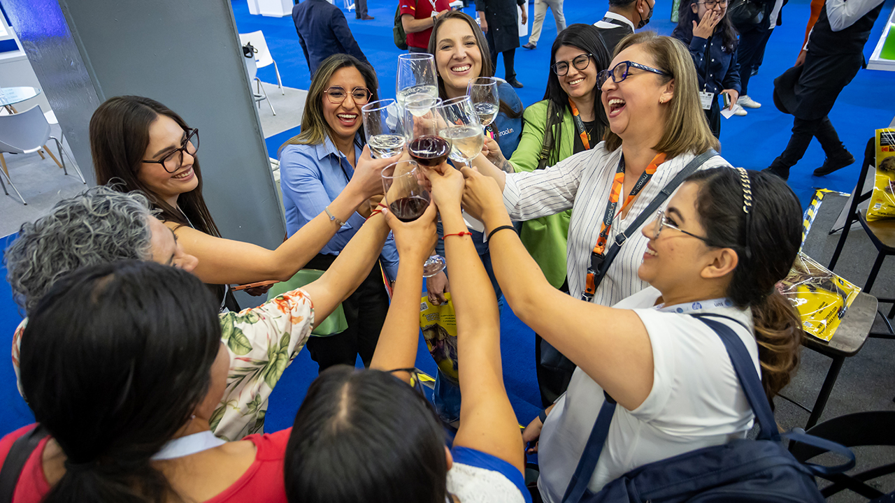 A group of women clink glasses at Labelexpo Mexico in Guadalajara
