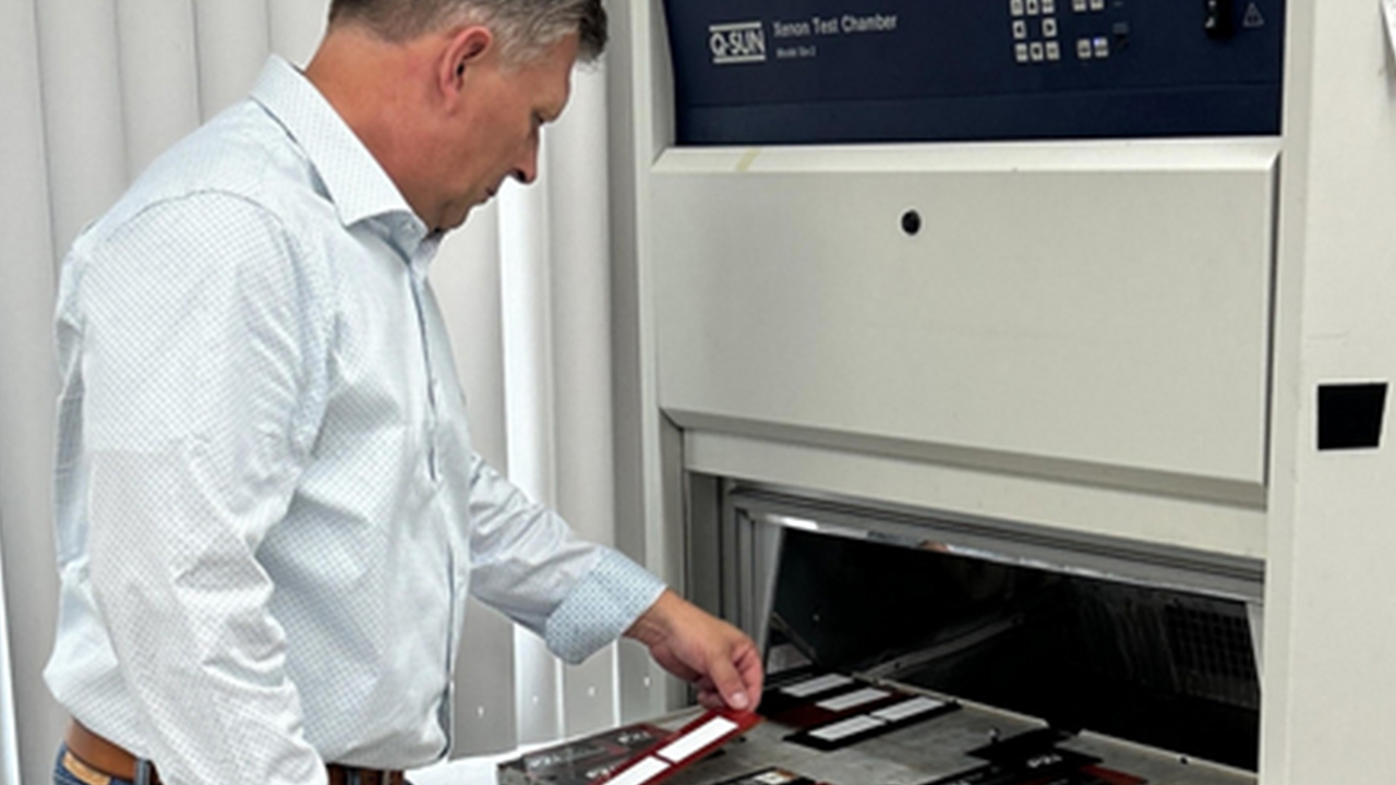 Robert Challman examines a label