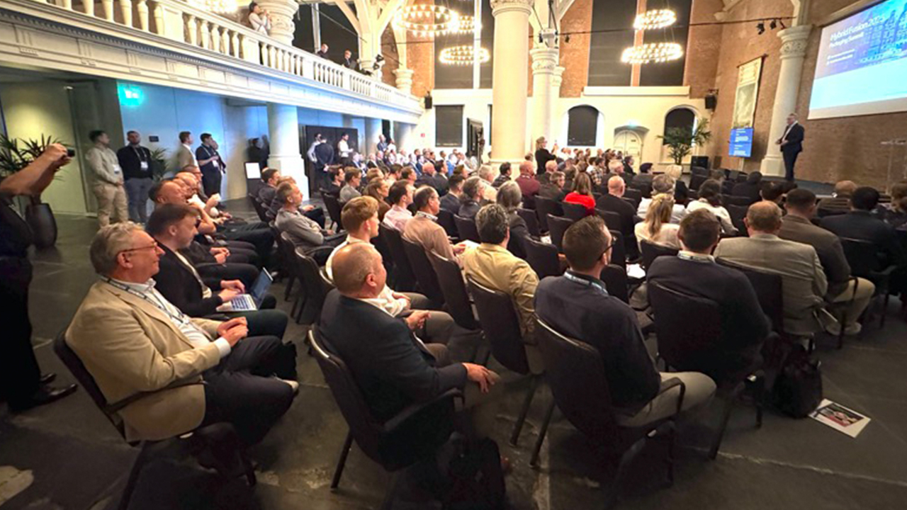 People sit in a conference room at the Fusion Packaging Summit in Amsterdam