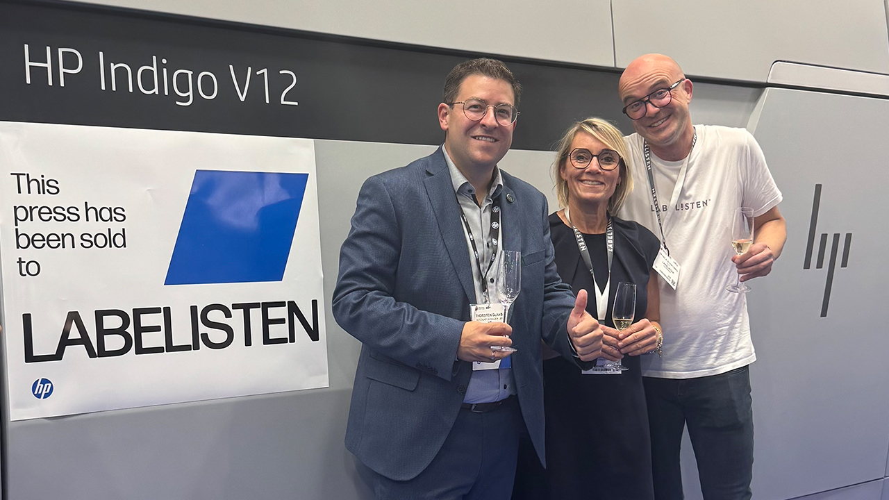 Frank and Franziska Plechschmidt with HP's Thorsten Glaab with a HP Indigo V12 press at Labelexpo Europe in Barcelona