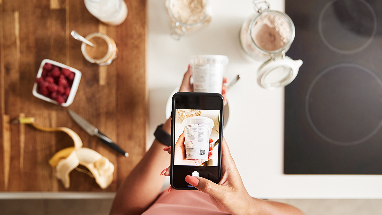 A phone scans a label QR code