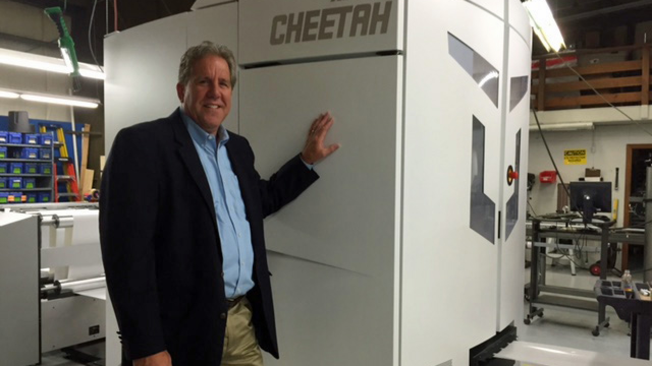 Douglas E. Rice, president and CEO of Action Packaging Systems, with the company's new Xeikon CX3 Douglas E. Rice, president and CEO of Action Packaging Systems, with the company's new Xeikon CX3