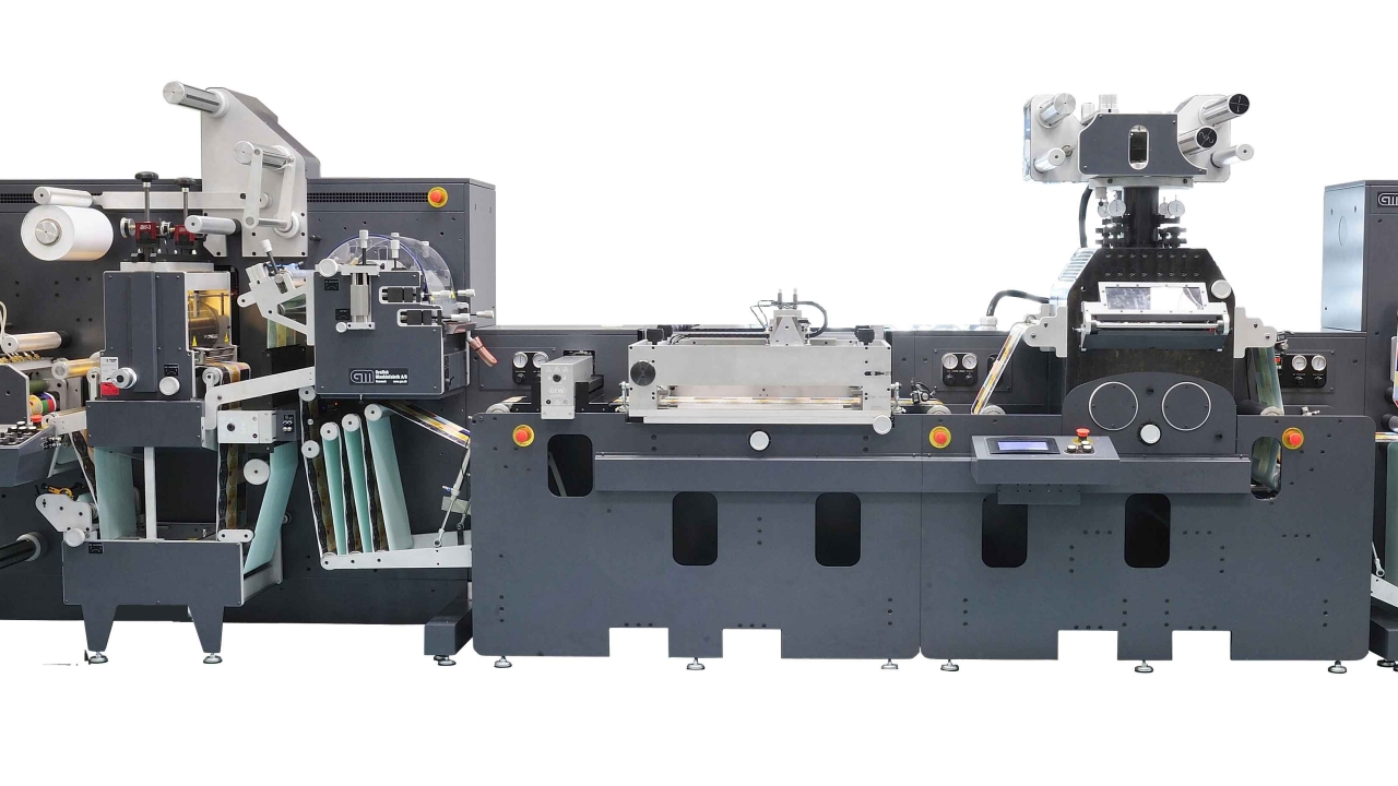 As well as hot stamping and screen printing modules, the line includes flexographic varnishing with registration for cold foil, cast and cure and semi-rotary die-cutting As well as hot stamping and screen printing modules, the line includes flexographic varnishing with registration for cold foil, cast and cure and semi-rotary die-cutting