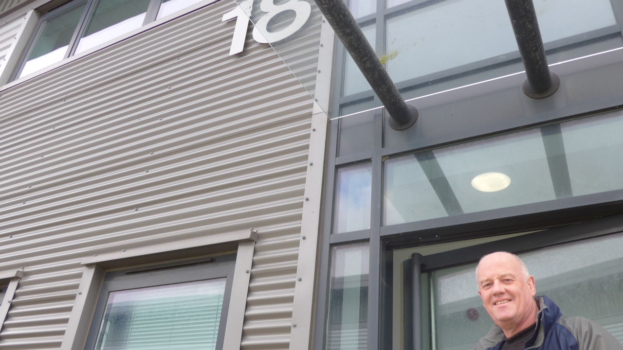 John Corrall, IIJ managing director and founder, in front of the company's new building which will host a dedicated customer center