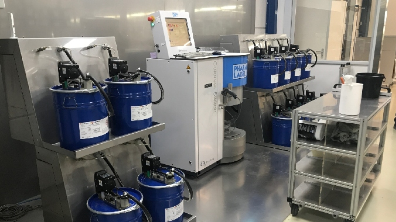 Dispensing equipment in a clean, organized ink kitchen at Pharmalabel in the Netherlands