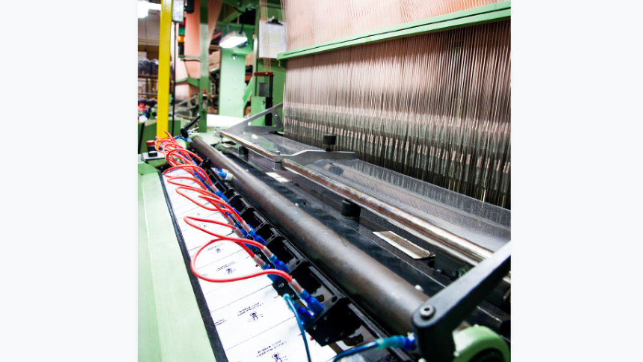 Wright Global Graphics uses a powered loom for its woven labels