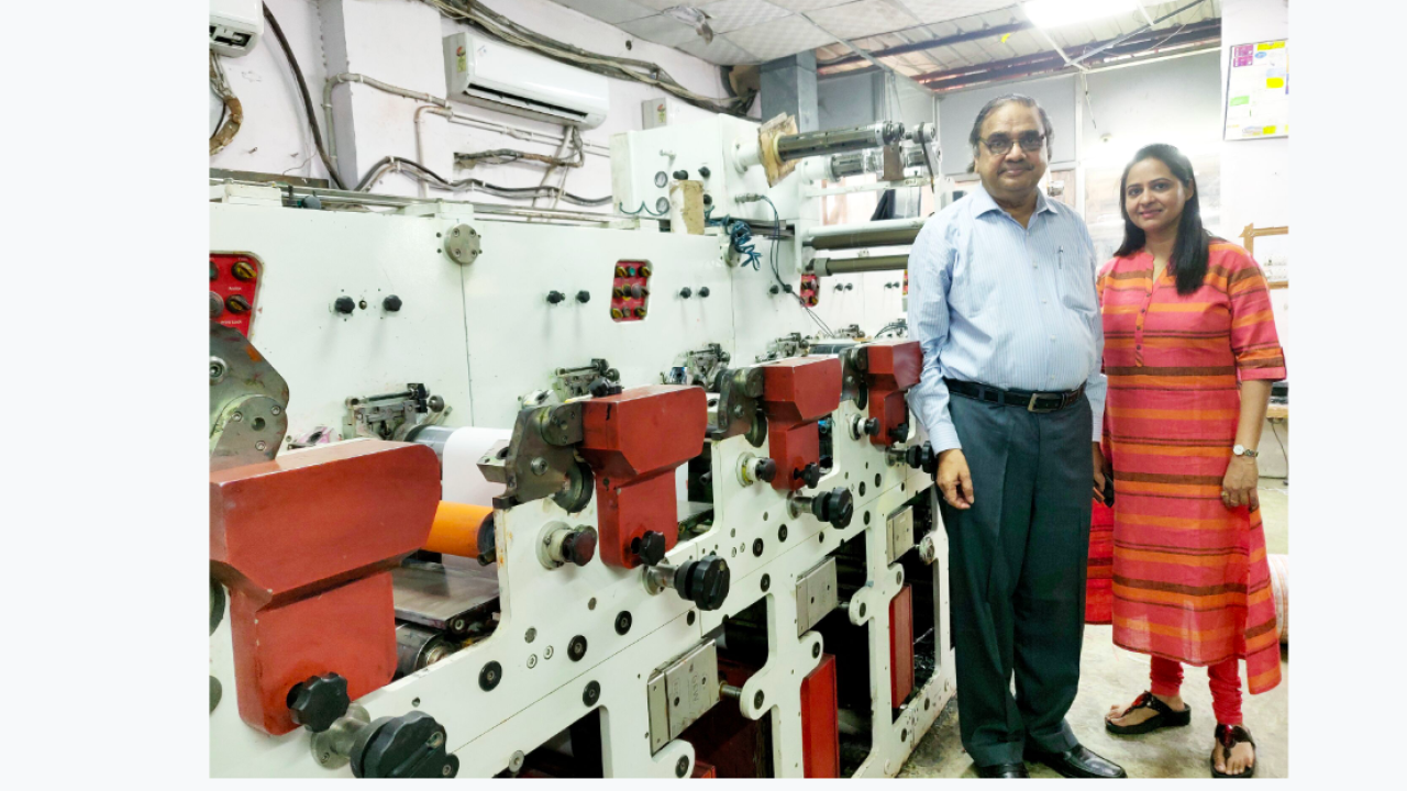 L-R: Deepak Gupta and Divya Gupta in front of the Multitec press