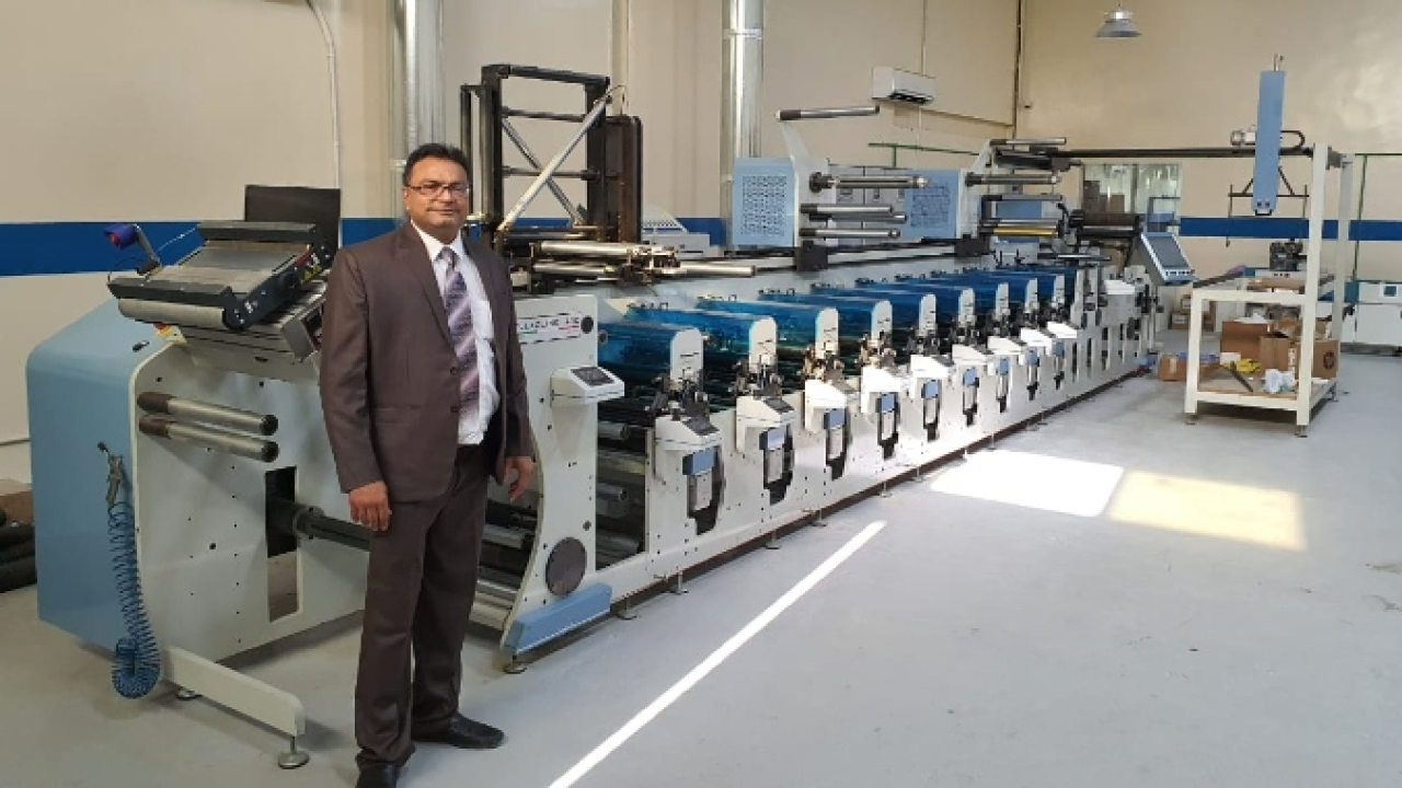 Saqar Ali, owner of Paramount Label Printing Press, with the Lombardi Flexoline 430 