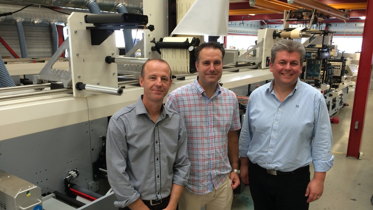 Pictured: Abbey Labels chairman Tom Allum and managing director Barry Pettit with Nick Tyrer (left), sales director of MPS UK, in front of the new press