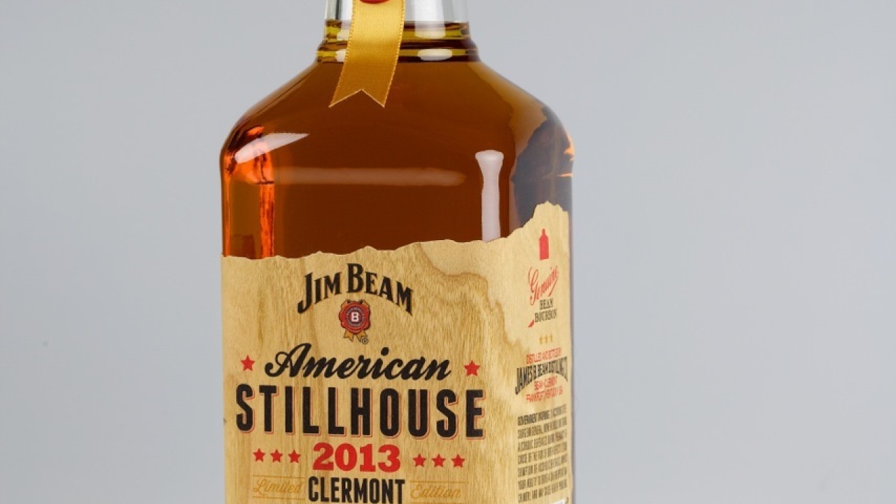 THe wood veneer pressure-sensitive label evokes the barrel ageing process of making bourbon