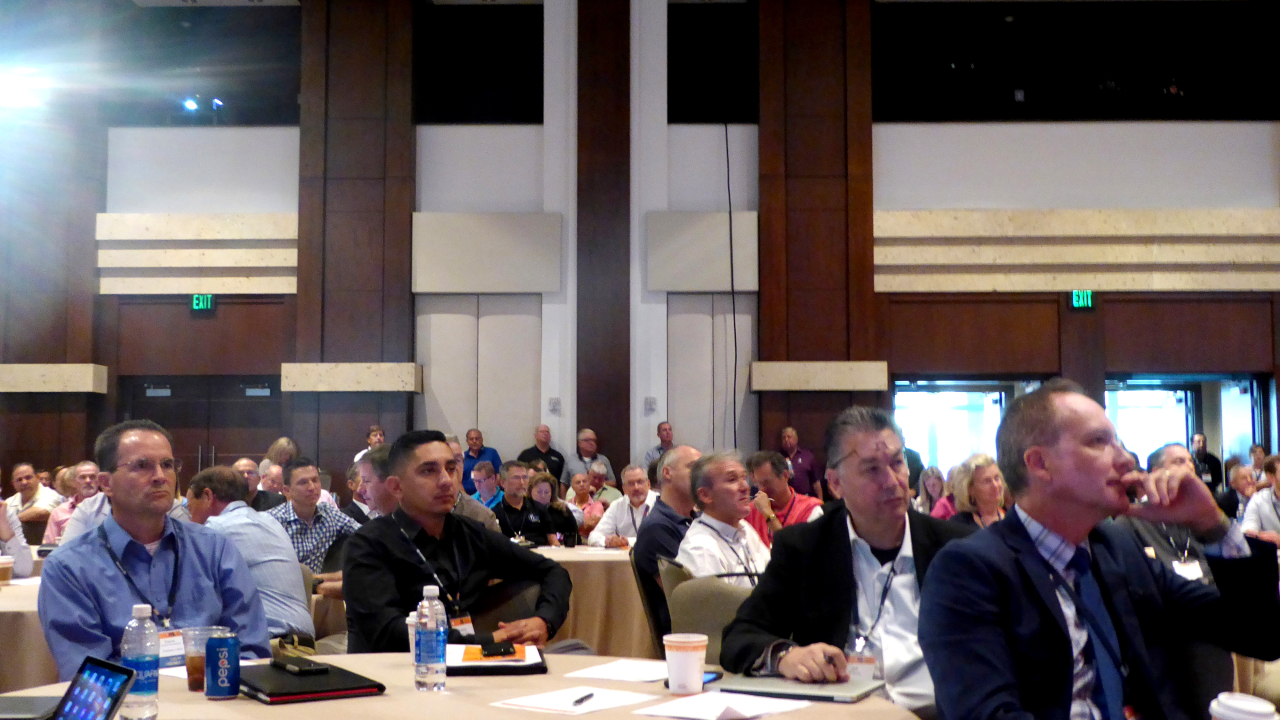 A panel discusses environmental issues at the TLMI annual meeting