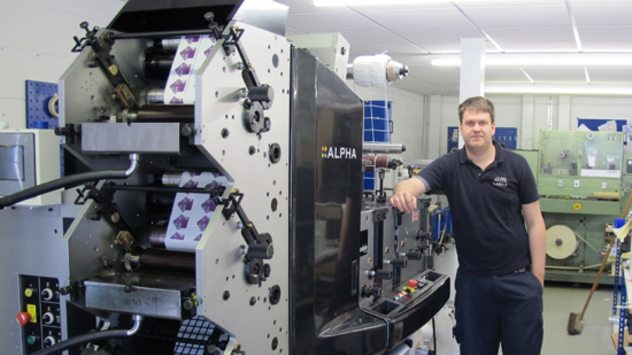 Tony Spooner and the new Alpha installed at AM Labels Tony Spooner and the new Alpha installed at AM Labels