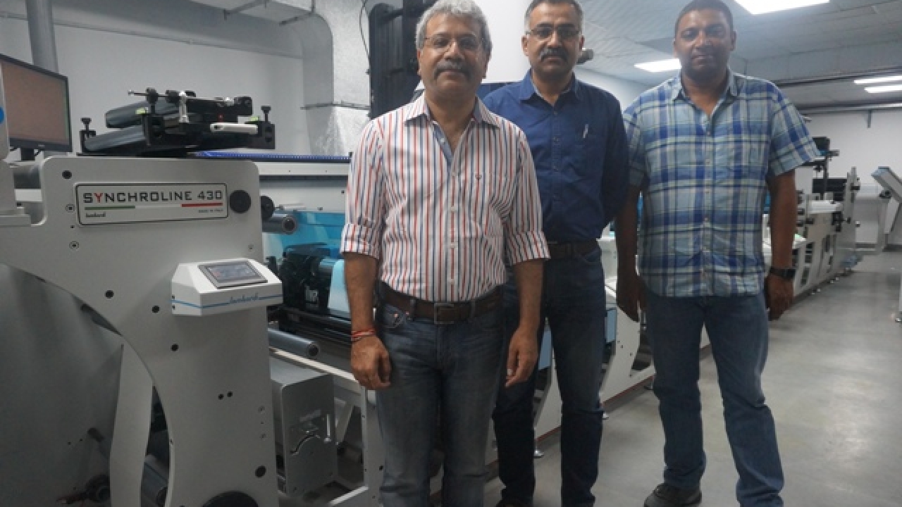 Raman AnancdChahl (left), Neovation Graphics co-director and CEO, with the other two directors of the company in front of the new Lombardi Synchroline