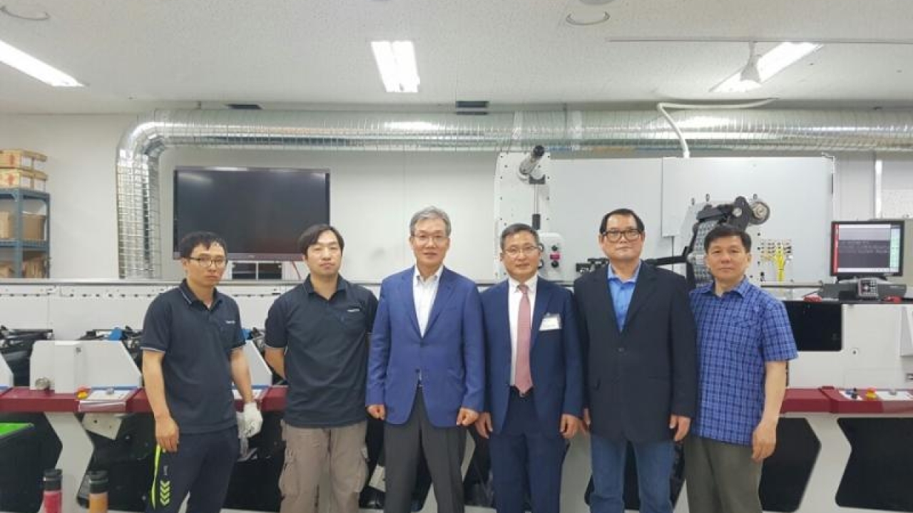 Pictured (from left): Yoo, Jong-Sun (operator, Tomatec); Lee, Jin-Won (chief operator, Tomatec); Jeon, Seak-Yong (owner and CEO, Tomatec; C. B. Park (Phil-Tech); Yoo, Jeong-Hee (technical director, Phil-Tech; Lee, Geo-Chang (factory manager, Tomatec)